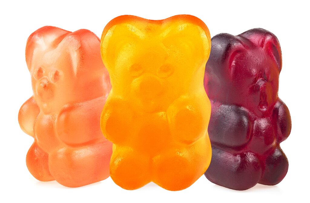 A variety of colorful gummy candies in different shapes and translucent colors, made with BioconColors natural colorants such as Anthocyanins, Carmine, and Turmeric.